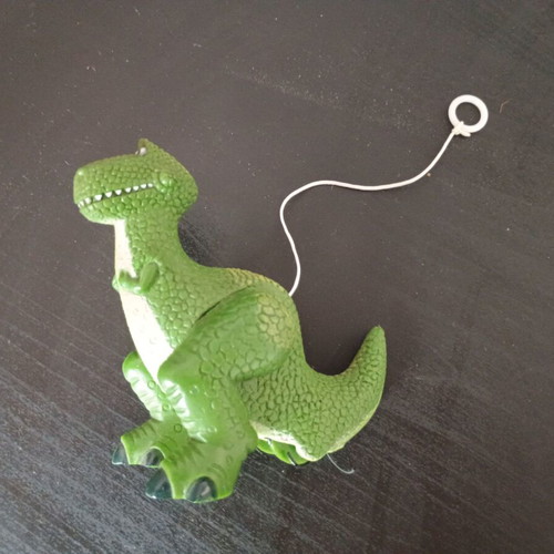 Small green dinosaur toy