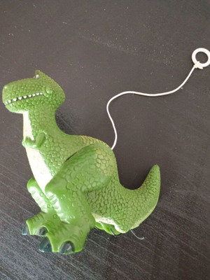 Small green dinosaur toy