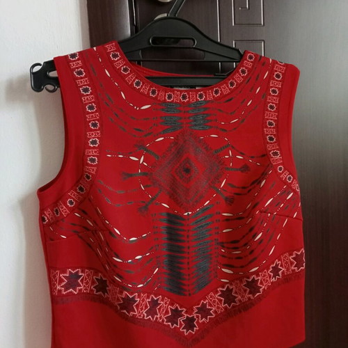Red sleeveless top with ethnic geometric motifs, like new