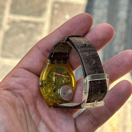 Vintage Swatch Swiss watch 34mm, transparent yellow case, brown strap