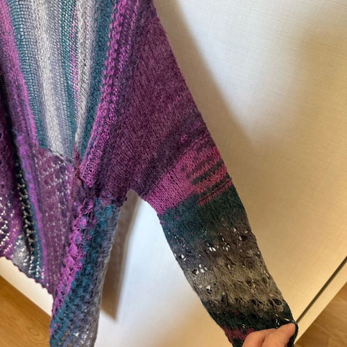 Knitted cardigan like new, multicolored with two patterns