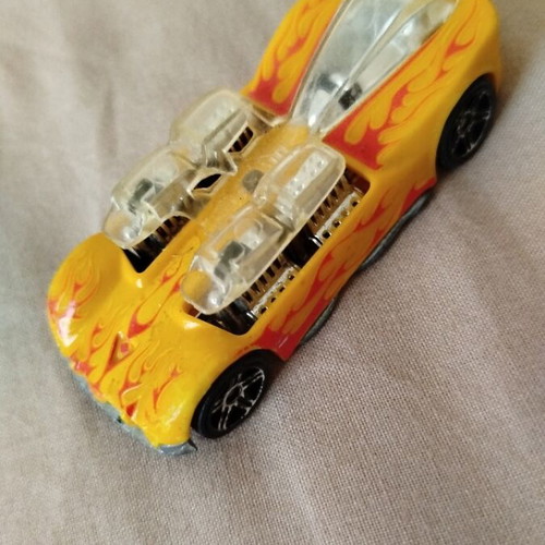 Hot Wheels metal toy car like new, yellow with orange flames by Mattel