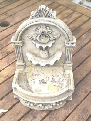 Decorative wall fountain used, cement or marble