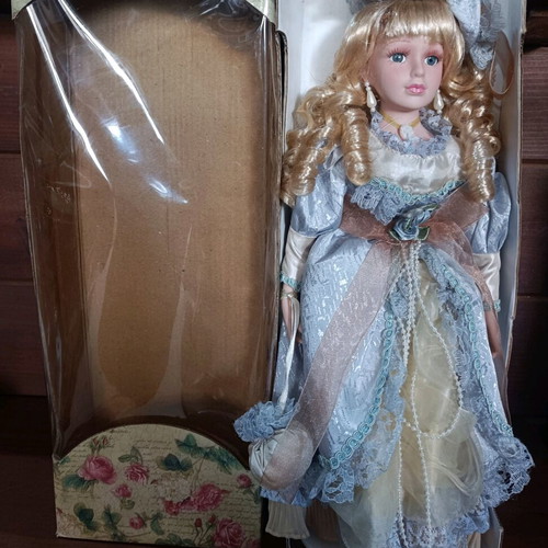 Porcelain doll with stand new, vintage style