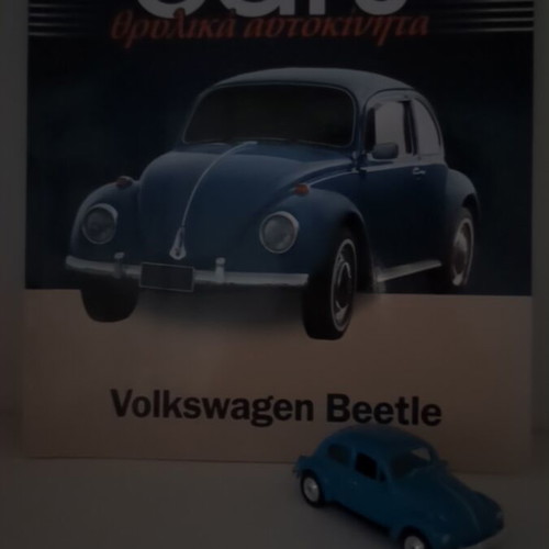 Volkswagen Beetle collectible book and metal model like new