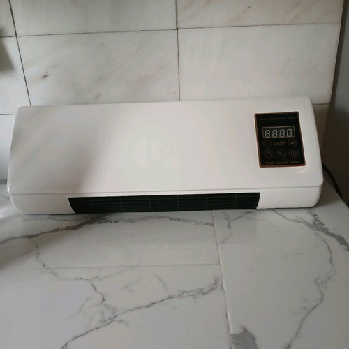 Wall-mounted 2000W heater with remote control, like new