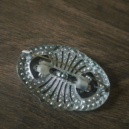 Brooch used, gray color