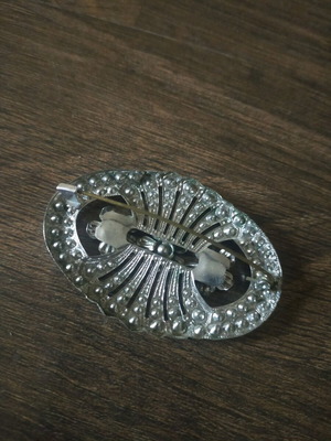 Brooch used, gray color