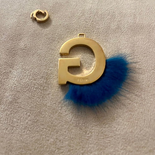 Fendi bag charm letter G with blue fur, like new