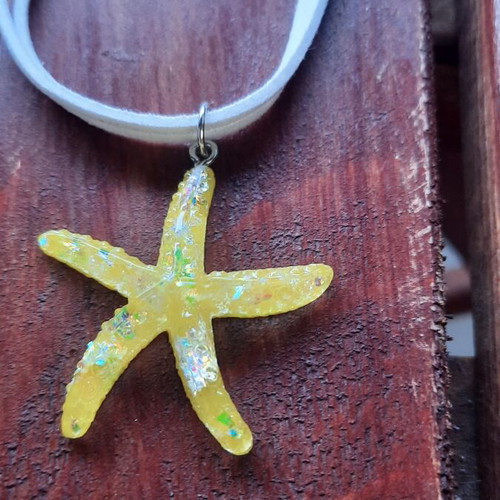 Handmade starfish pendant necklace with white cord, yellow iridescent
