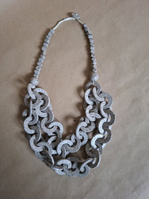 Long necklace like new made of pressed natural materials gray and beige