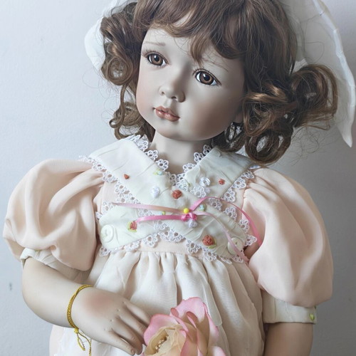 Alberon Casey porcelain doll with wooden stand, 50cm