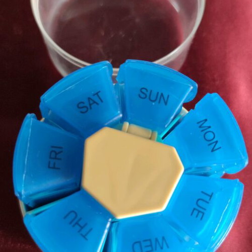 Rotating plastic weekly pill organizer new medication storage device