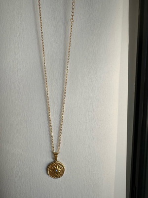Stainless steel necklace new, gold color with blue zircon