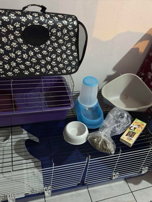Rabbit starter kit like new with cage, pellets, feeder, and waterer