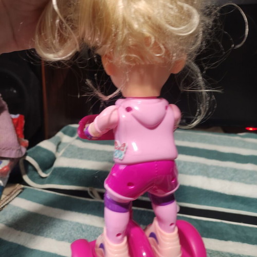 Doll with scooter, sound and lights, like new