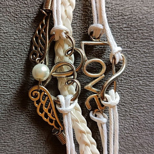 Love bracelet set new with white cords and charms