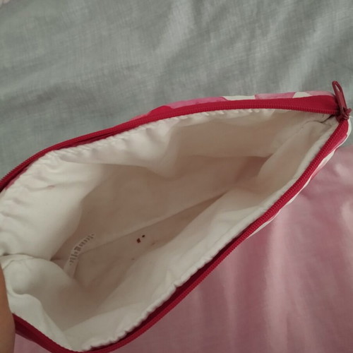 Toiletry bag A.L.E. used, red and pink hearts, slight lipstick stain