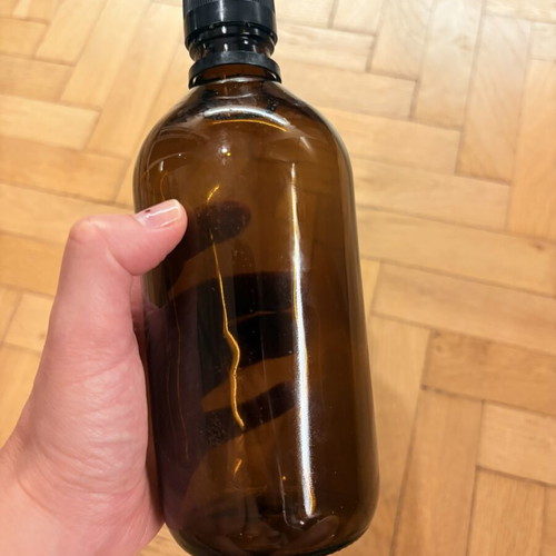 Brown glass pharmacy-style bottle with cap