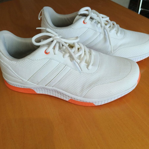 White athletic shoes like new with orange sole size 44
