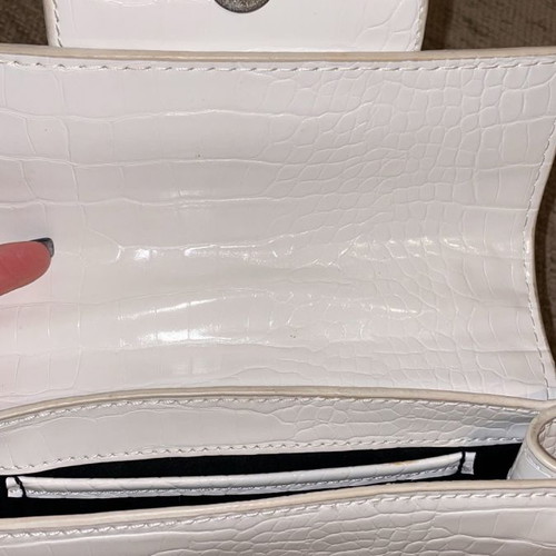 White crossbody bag used with silver details