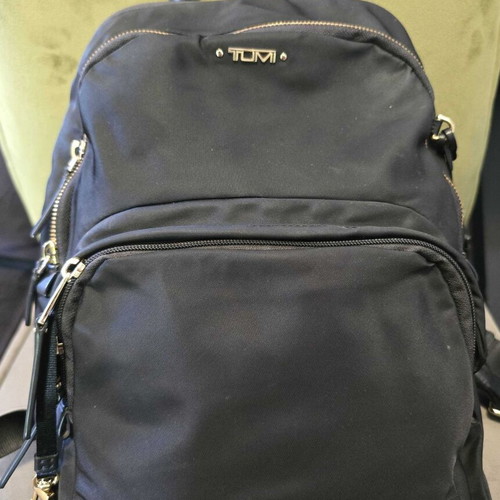 Tumi backpack used, black with gold details