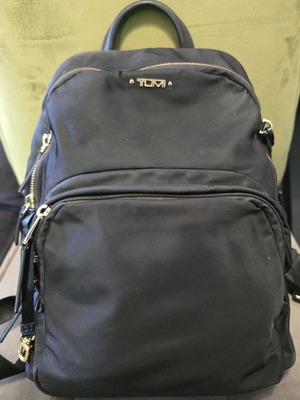 Tumi backpack used, black with gold details