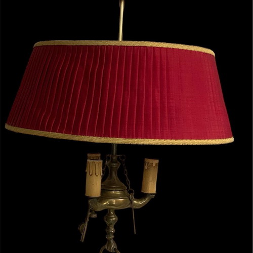 Vintage brass ceiling light with three lamps and red shade used