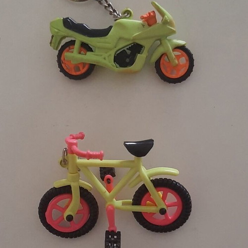 Vintage motorcycle and bicycle keychains used, colorful