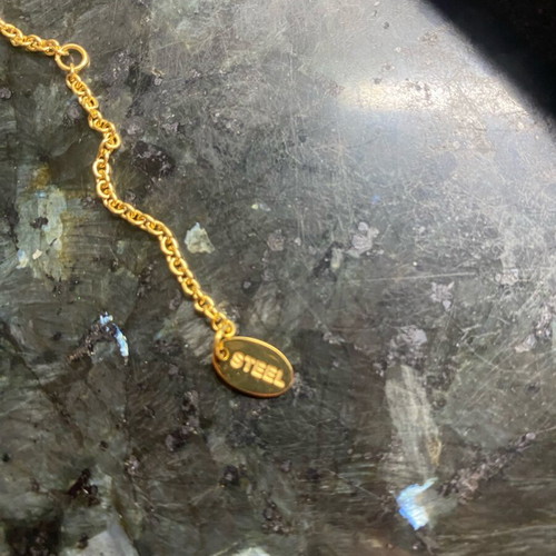 Crystalp steel cross gold color new with missing stone