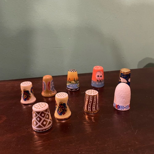 Set of 9 porcelain thimbles like new, collectible
