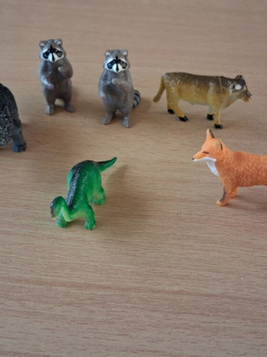 Plastic small animal figures and one human figure used