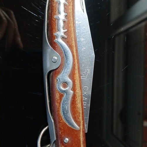 Okapi pocket knife used, carbon steel blade, wooden handle