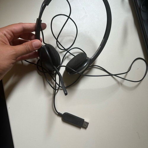 Wired computer headphones with microphone used