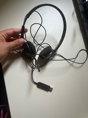 Wired computer headphones with microphone used