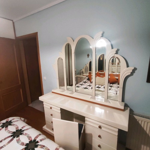 Dressing table with chair used and drawers on both sides