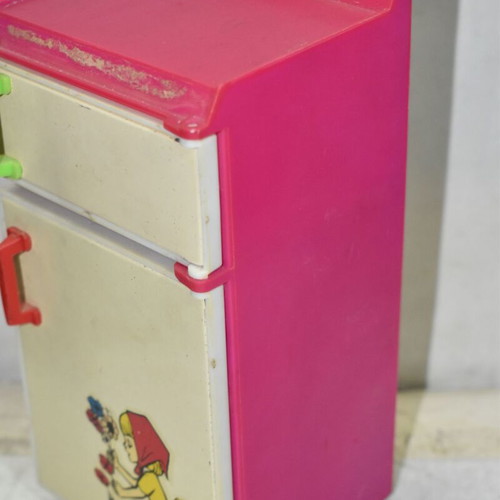 Retro children's kitchen fridge used, plastic and metal with illustration