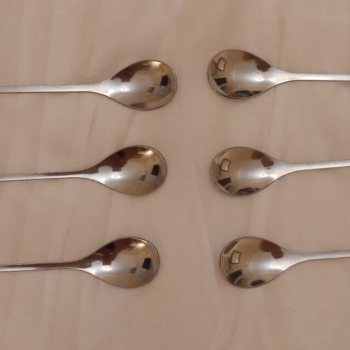Set of 6 stainless steel spoons with leaf design like new