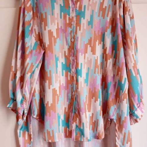 Oversized asymmetrical shirt in pastel shades