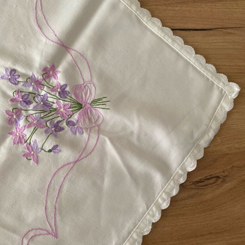 Rectangular table cloth used, white with pink and purple flowers 80x80cm