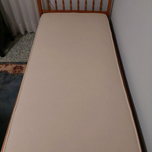 Single solid wood bed used with new mattress