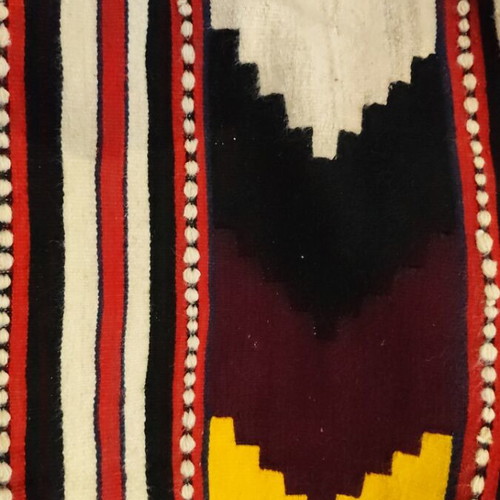 Woven rug used with geometric motifs and fringes