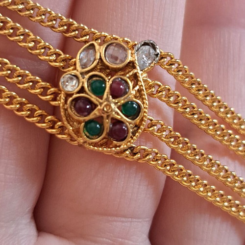 Vintage gold bracelet with colorful stones