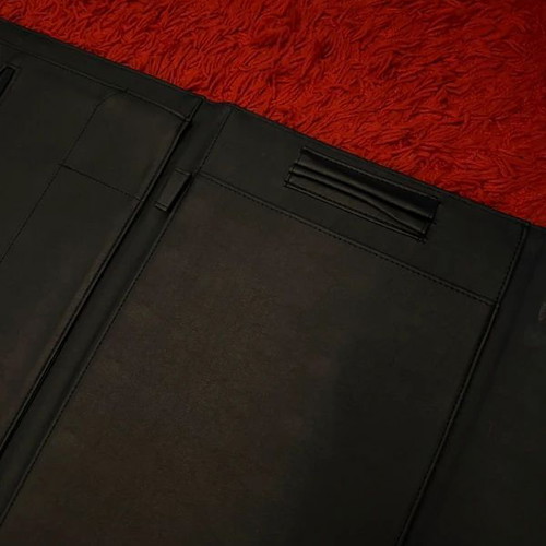 Clutch used, black with gold clasp, leatherette material