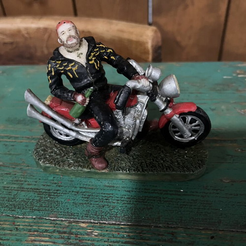 Vintage collectible biker figure on red motorcycle, like new