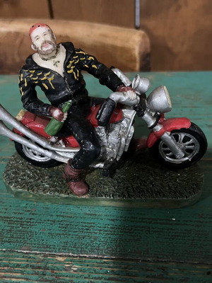 Vintage collectible biker figure on red motorcycle, like new