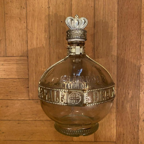 Collectible French liqueur bottle used with royal insignia