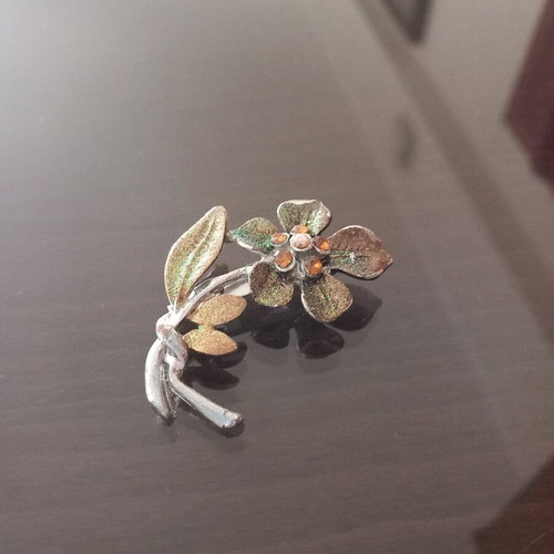 Flower pin used, orange and gold colors