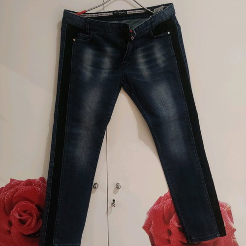 Women's blue jeans used with decorative lace on side size XL