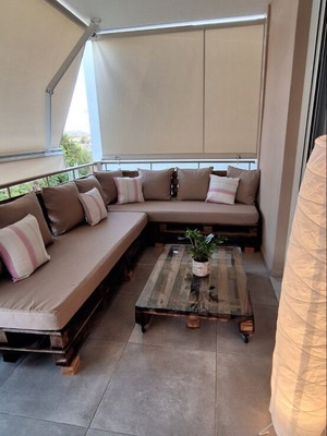 Corner sofa from pallets with glass coffee table like new